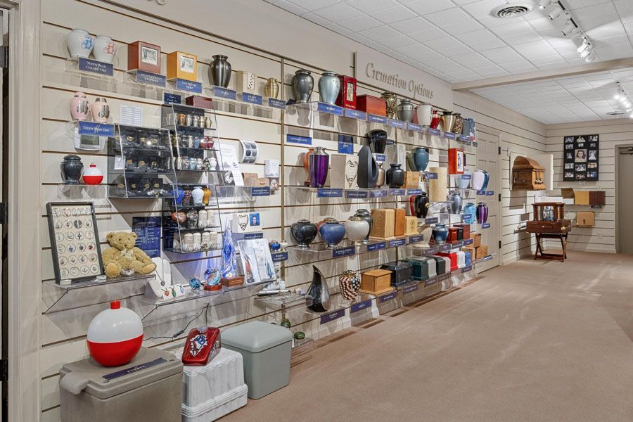 There are many different types of urns on display in this room.
