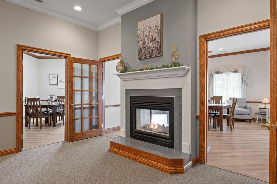 There is a fireplace in the middle of the room.