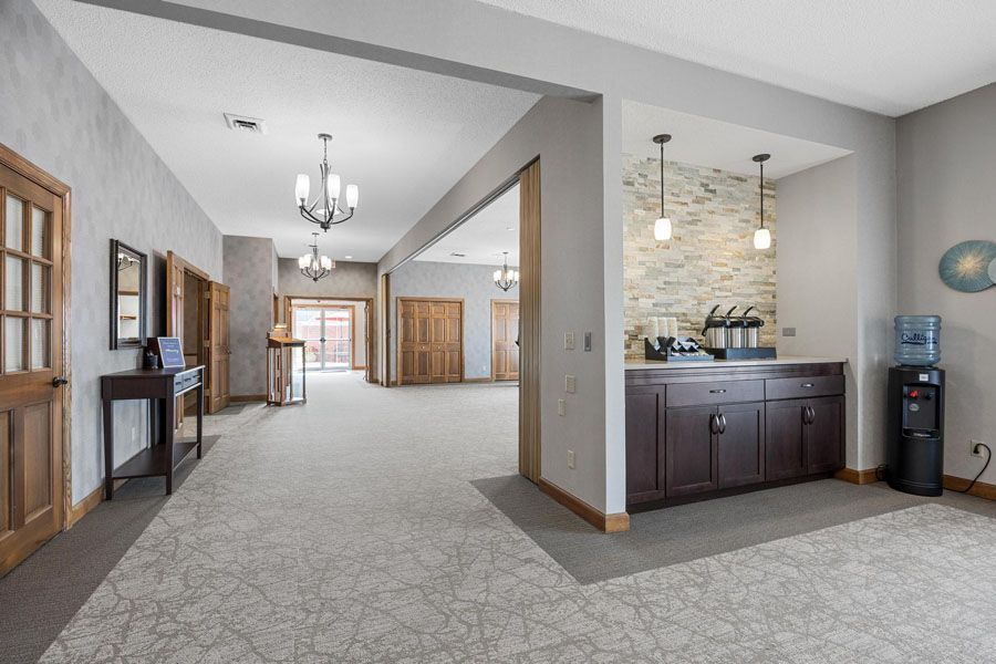 There is a kitchen in the middle of the room.