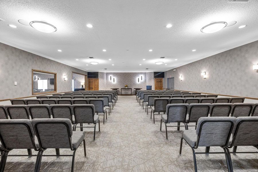 A large room filled with rows of chairs in a church.