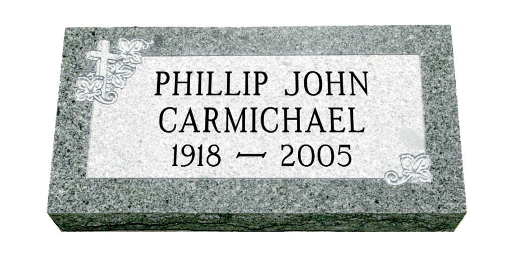 Gravestone plaque reading “PHILLIP JOHN CARMICHAEL, 1918–2005” on gray stone.