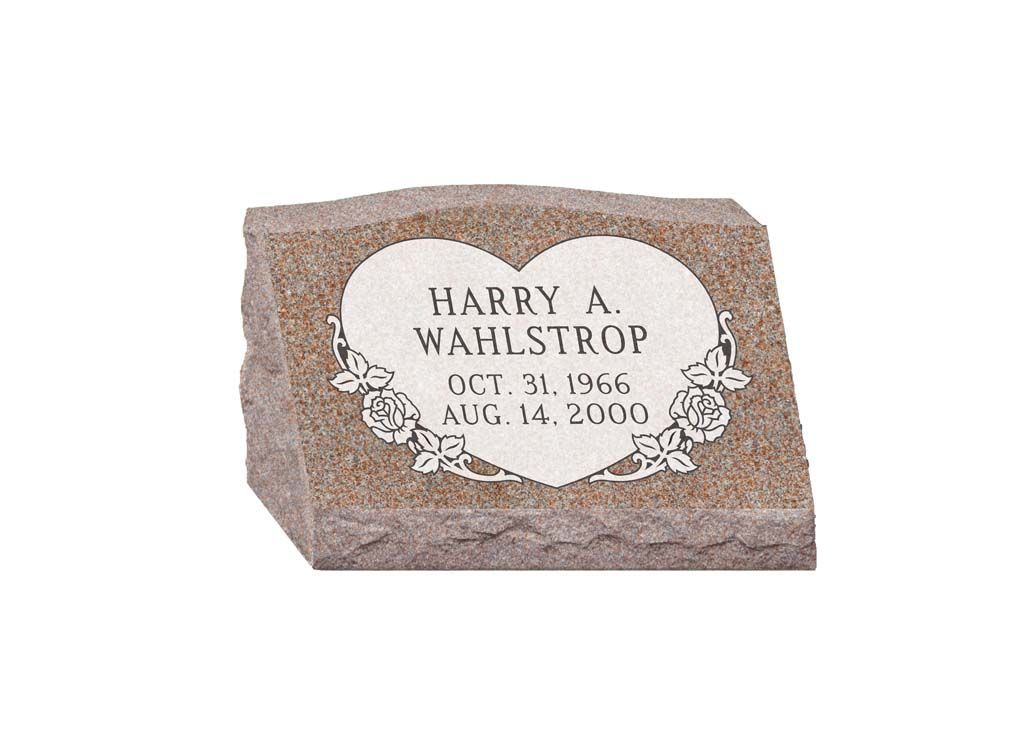 Memorial plaque on a stone marker reading “Harry A. Wabstrow,” with dates below.