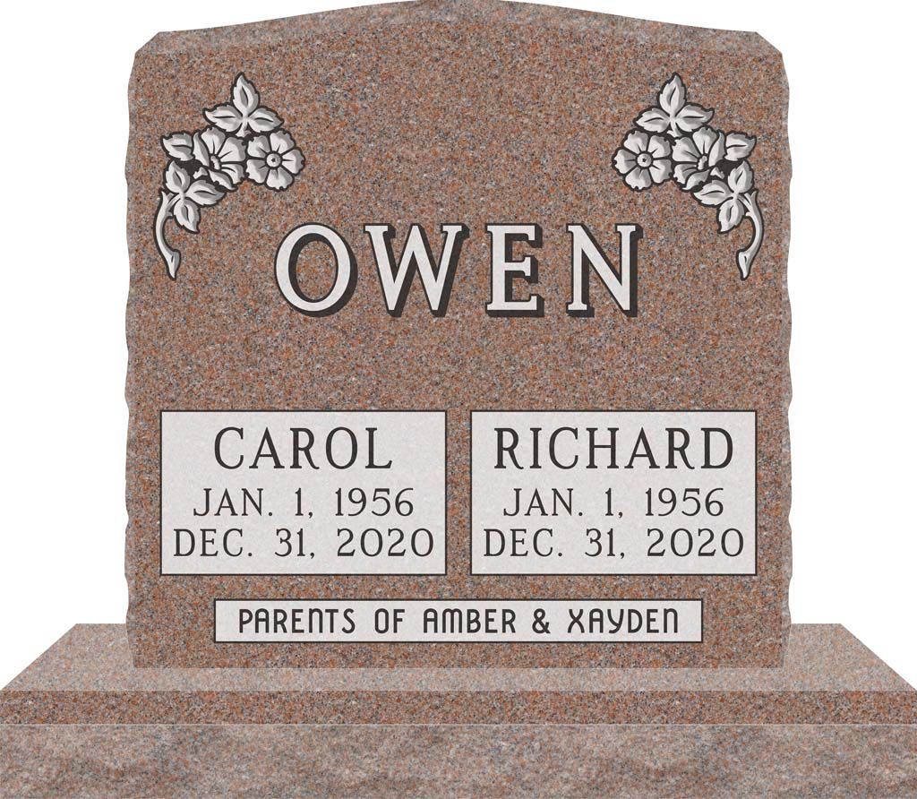 Gray granite gravestone with floral carvings and memorial plaques for Carol and Richard Owen.