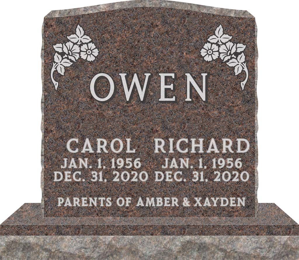 Brown memorial headstone engraved “OWEN” with names Carol and Richard, dates, and floral corners