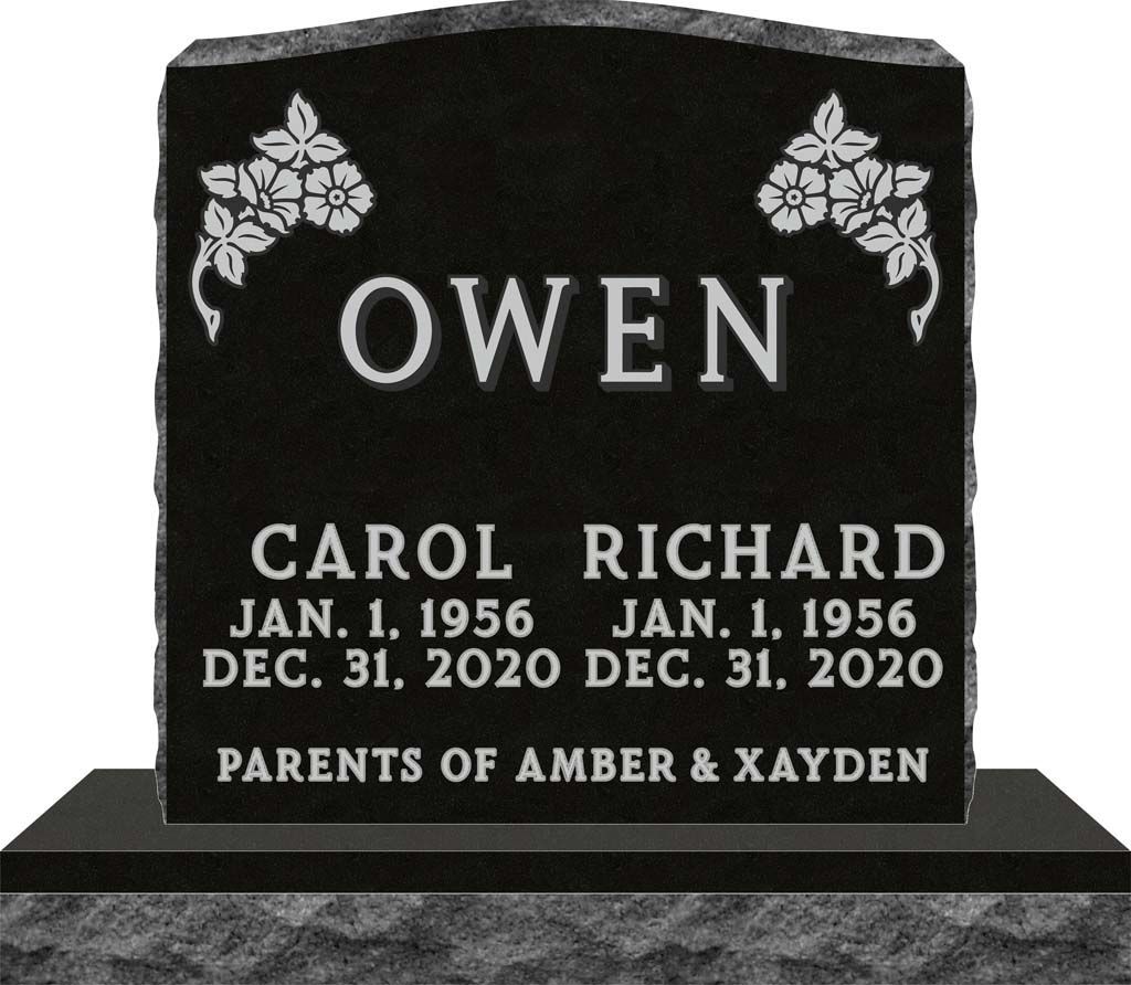 Black granite memorial stone engraved “OWEN” with names Carol and Richard, dates, and floral corners