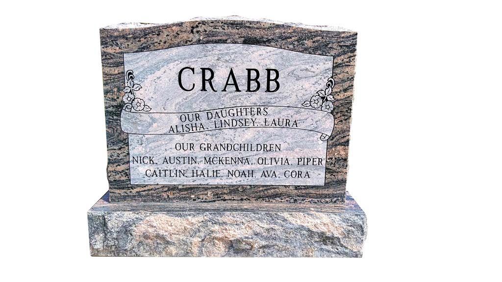 Gravestone for Crabb with weathered stone and engraved text on a light background