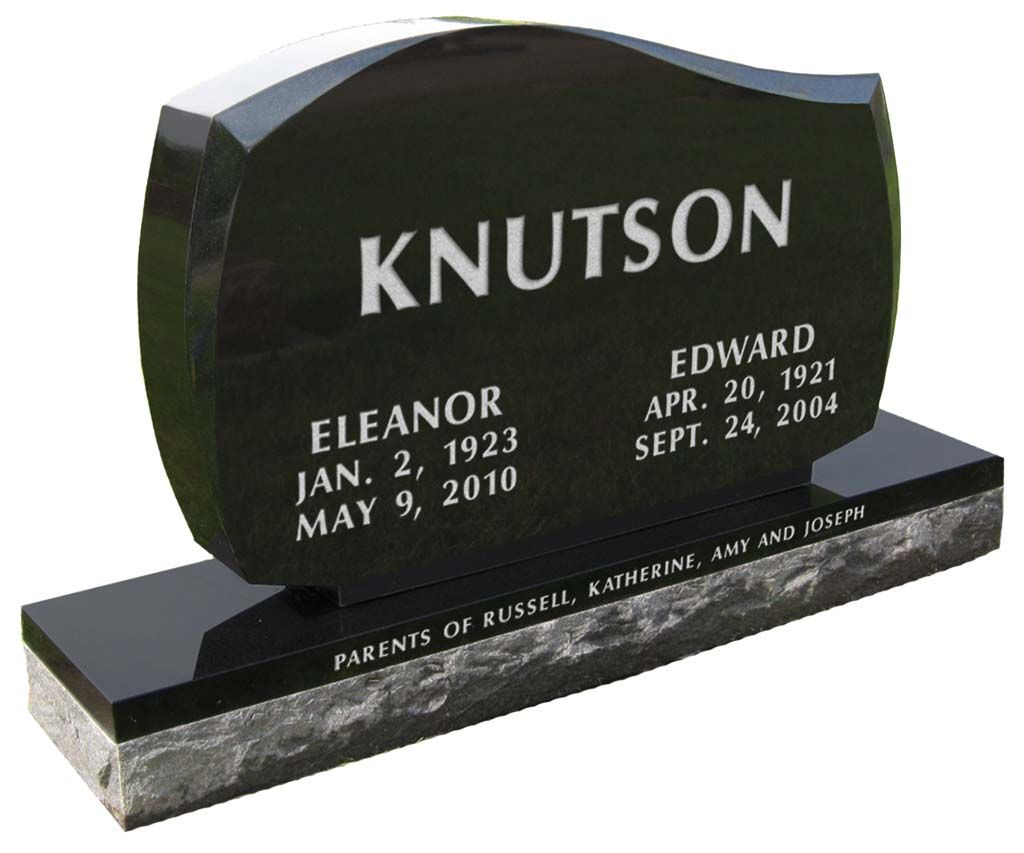 Black granite memorial headstone engraved “KNUTSON” with two names and dates on a base.