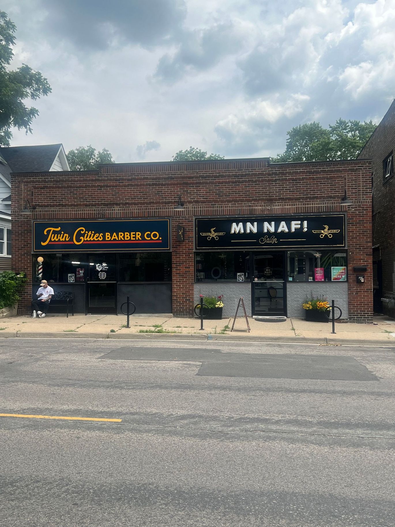 A brick building with a sign that says mn nafi