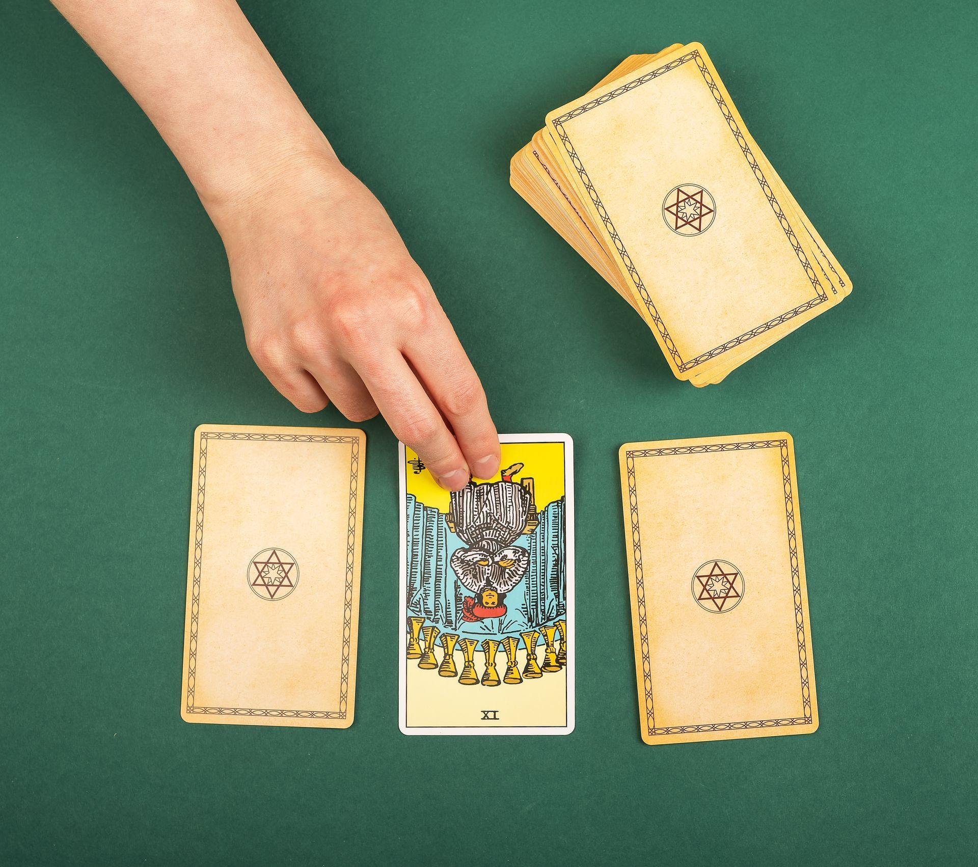 A person is playing a game of tarot with the tower card