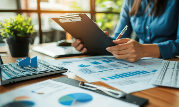 Accounting Services in Overland Park KS by AA Accounting, LLC reviewing financial charts and reports