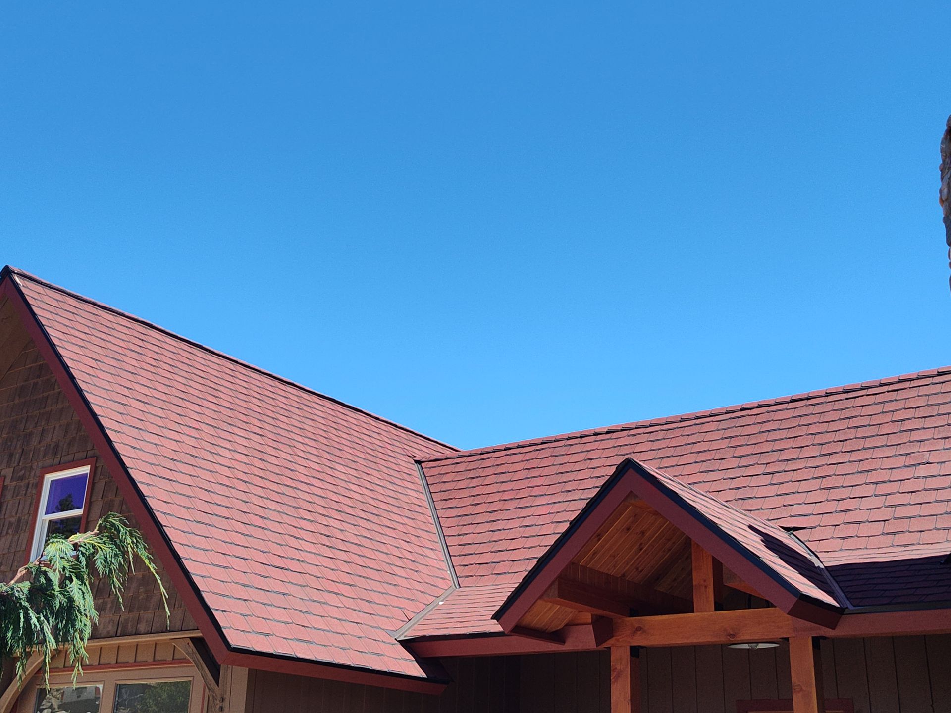 A house with a red roof and a blue sky in Malaga, WA