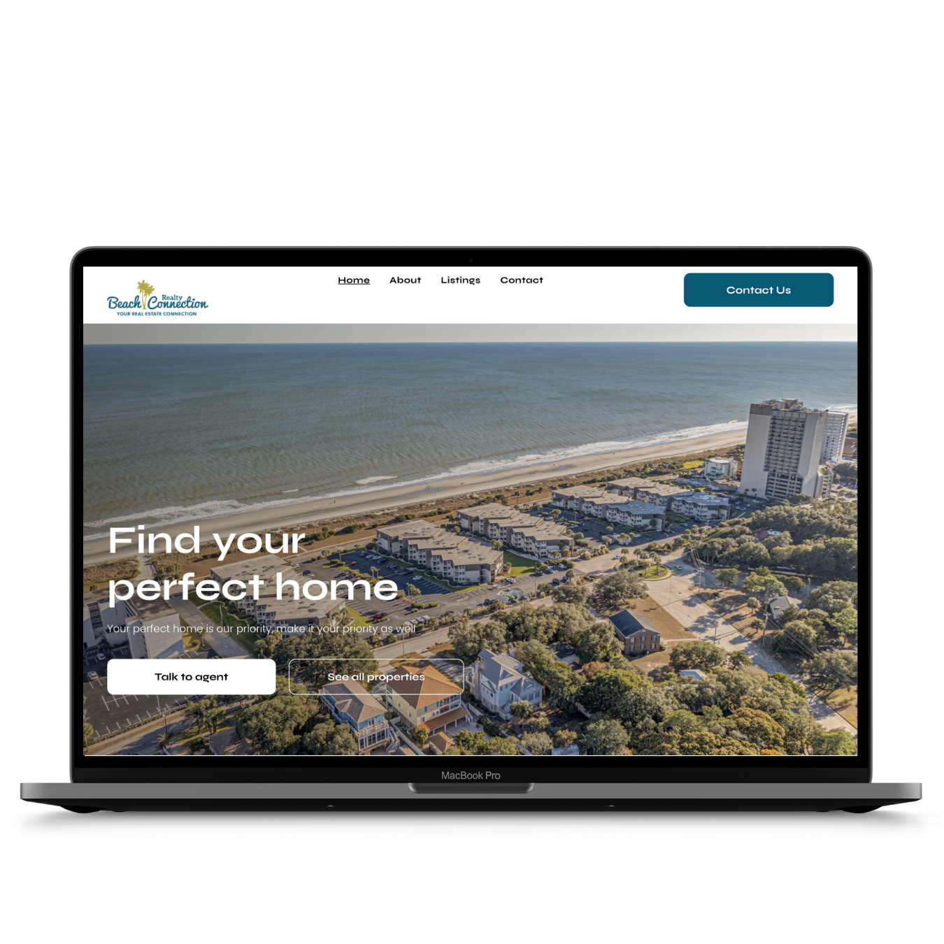 A laptop computer is open to a website that says `` find your perfect home ''.