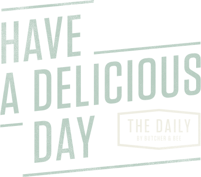 The logo for the daily butcher & deli says `` have a delicious day ''.