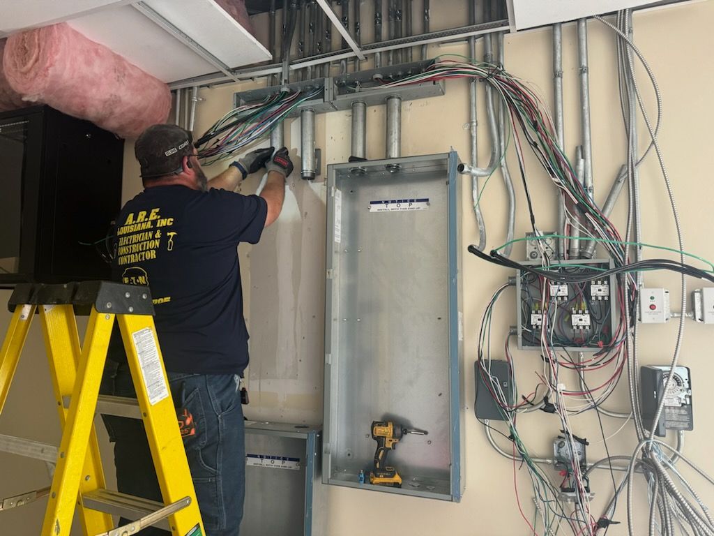 Electrician upgrading electrical panel in LaPlace, Louisiana.