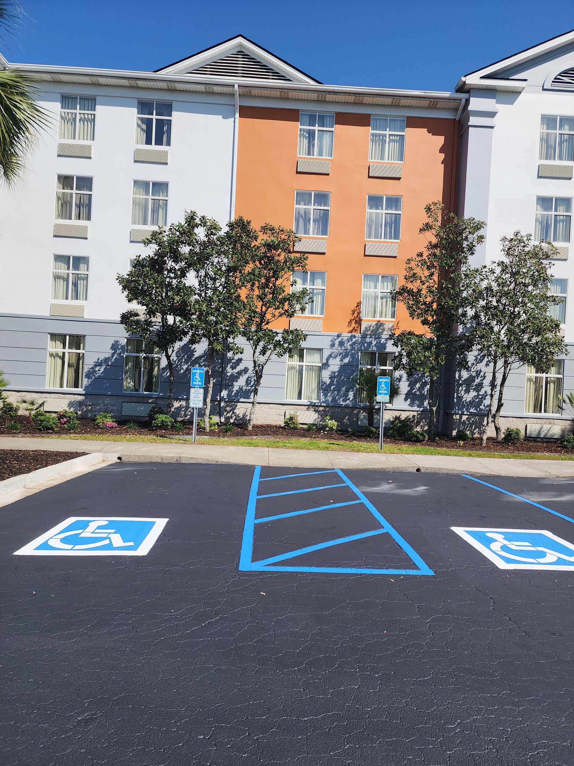 Smooth asphalt surface and bright parking lines at hotel parking lot in North Charleston, SC.