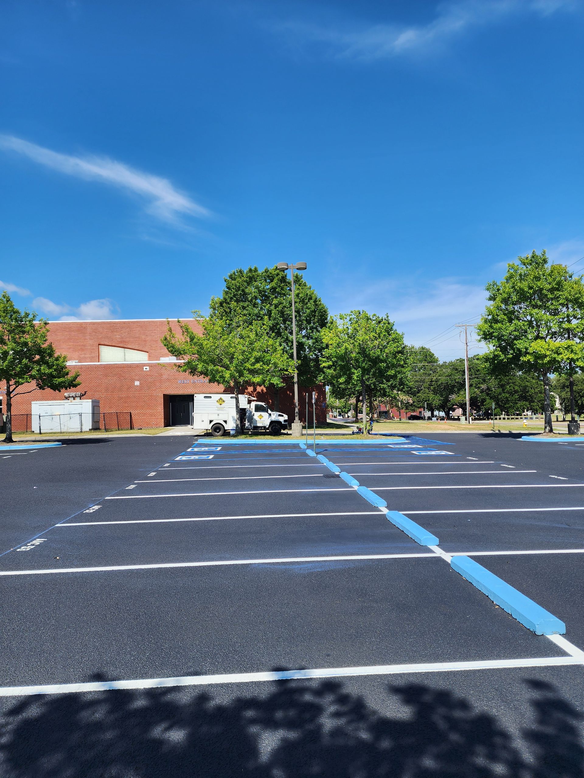 Smooth commercial parking lot after professional asphalt paving in North Charleston, South Carolina.