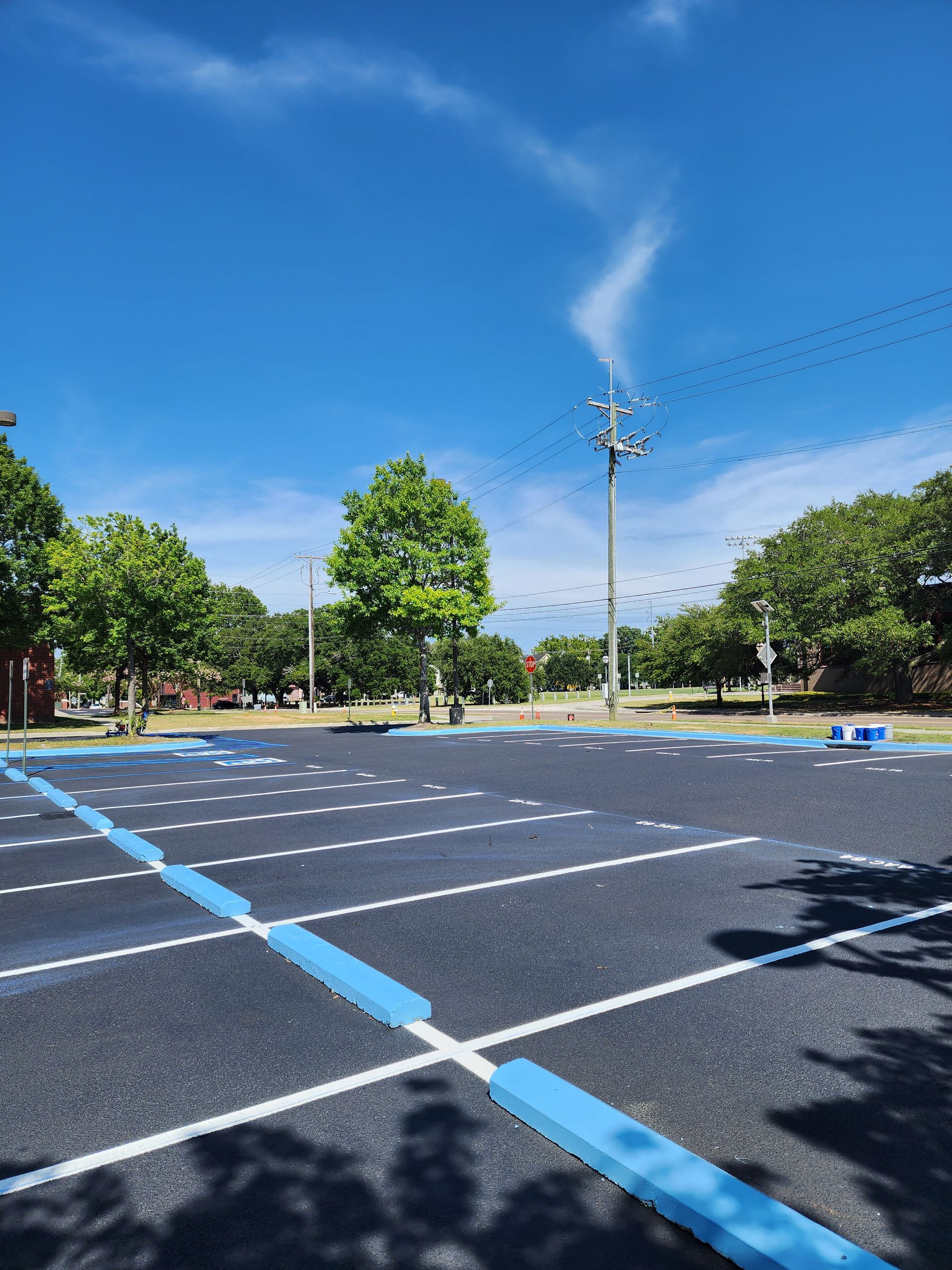 Smooth commercial parking lot after professional asphalt paving in North Charleston, South Carolina.