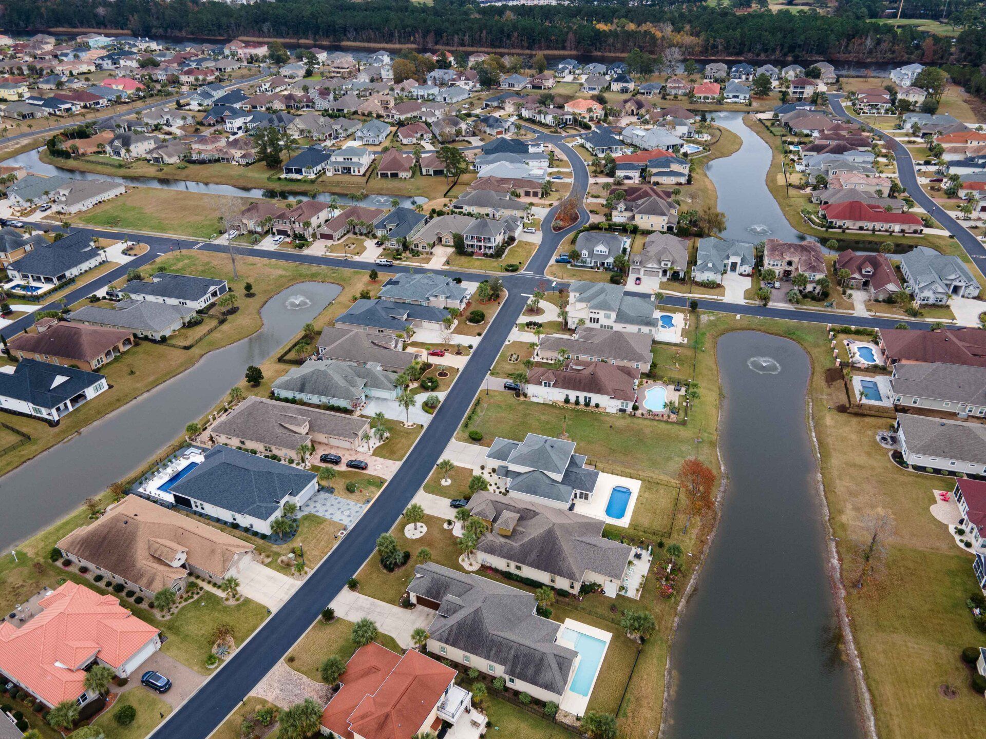 An aerial view of a residential area with lots of houses