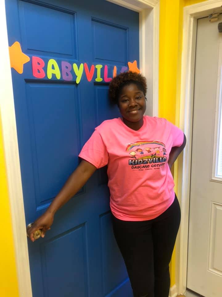 Woman Standing Beside The Door — Hammond, IN — Kidzville Daycare Center LLC.