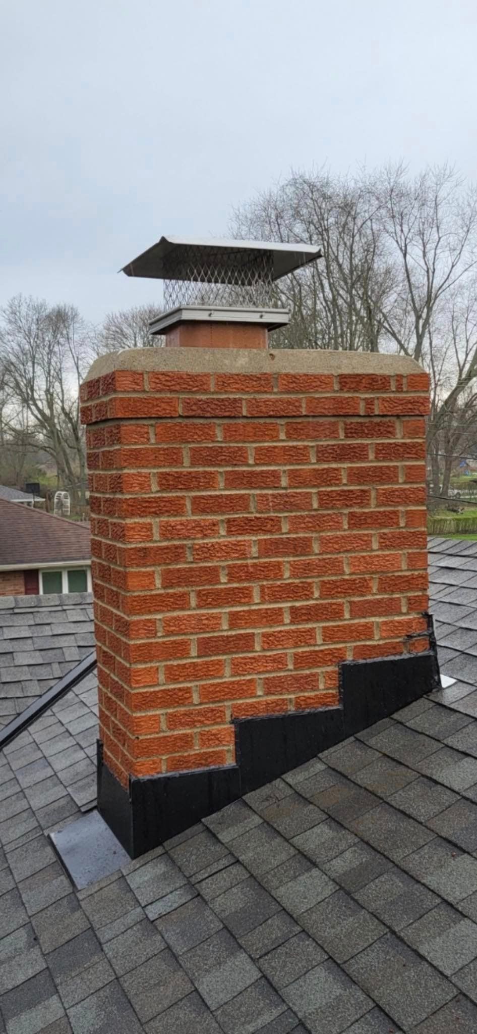 A brick chimney sitting on top of a roof – Dayton, OH - Miami Valley Chimney