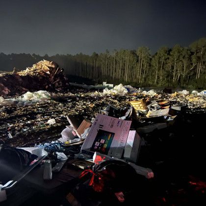 A pile of trash with a box that says ' samsung ' on it