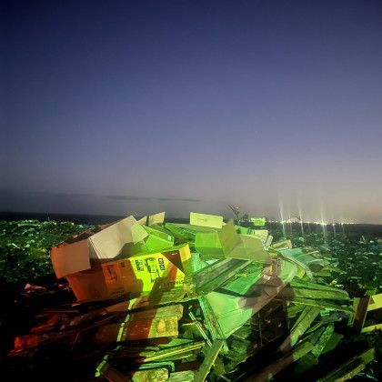 A bunch of boxes are sitting on top of each other in a pile.