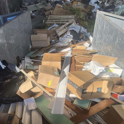 A pile of cardboard boxes with one that says ' a ' on it