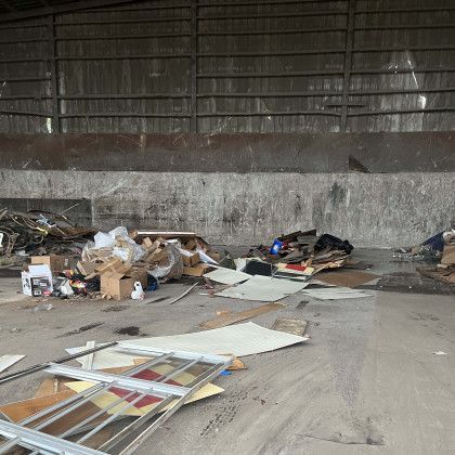 A warehouse filled with lots of trash and junk.