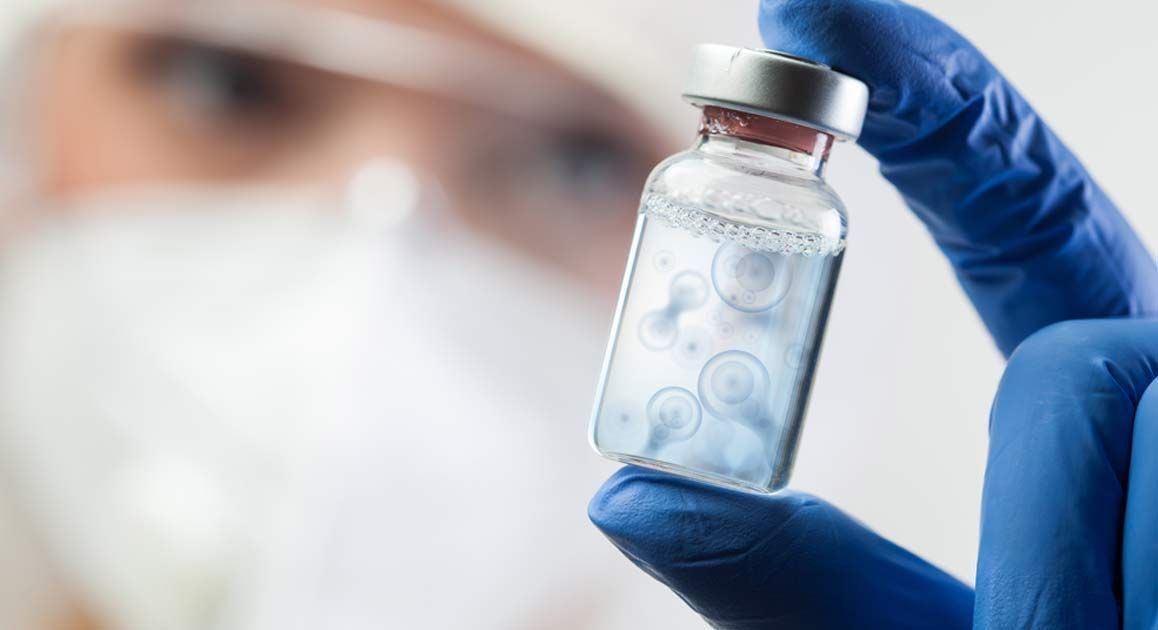 A doctor is holding a bottle of Orthobiologics in their hand for Emerging Therapies NJ and NYC at Victory Medical Institute.