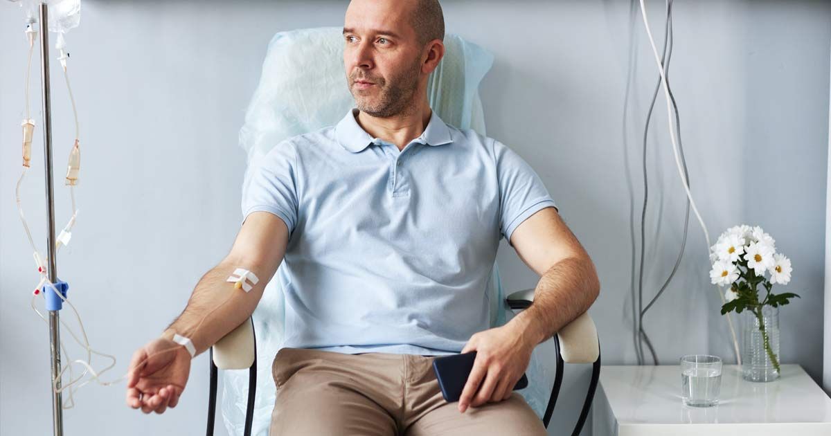 A man is sitting at Victory Medical Institute getting IV Therapy NJ and NYC