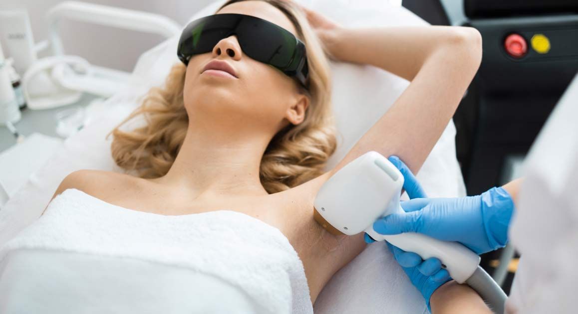 A woman is getting a Laser Hair Removal NJ and NYC at Victory Medical Institute