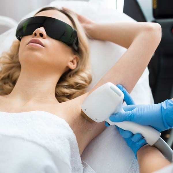 A woman wearing sunglasses is getting Laser Hair Removal with Diolaze
