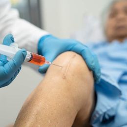 A person is getting an injection in their knee. Medical Modalities by Victory Medical Institute NJ