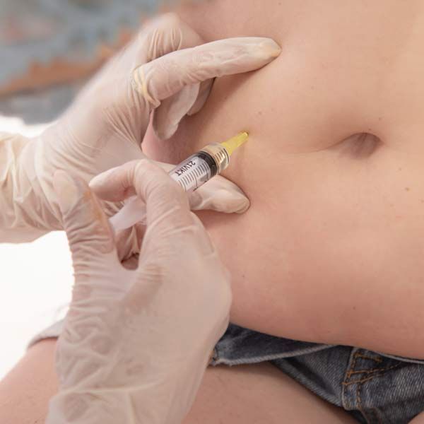 A person is getting Peptide Injections