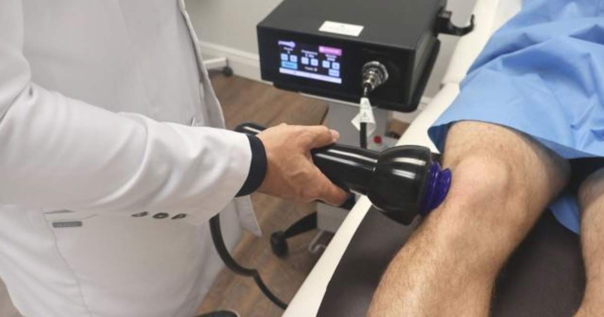 Doctor administering Shockwave Treatments NJ and NYC at Victory Medical Institute