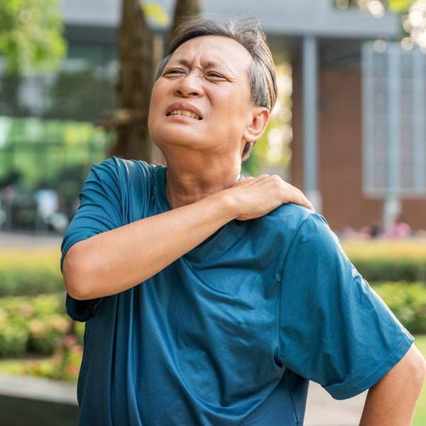 A man with shoulder pain is a candidate for Omniwave Shockwave System Treatments, Serving Patients in Morris Plains, New Jersey, and Manhattan, New York