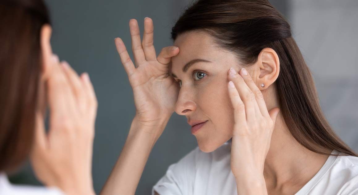 A close-up of a woman's face happy with her Skin Tightening Treatments NJ and NYC at Victory Medical Institute