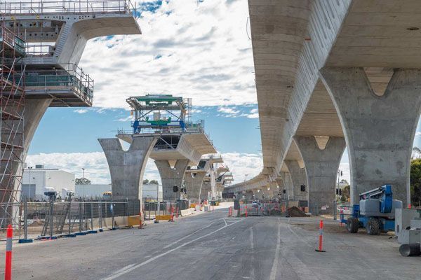 a highway under construction with a lot of concrete pillars .