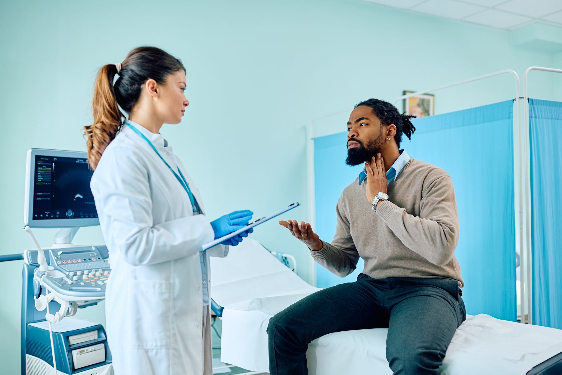 A black man goes to the doctor, he is benefiting from trends in employer sponsored health insurance
