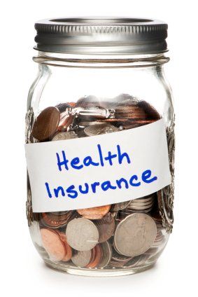 a jar of cash labeled health insurance