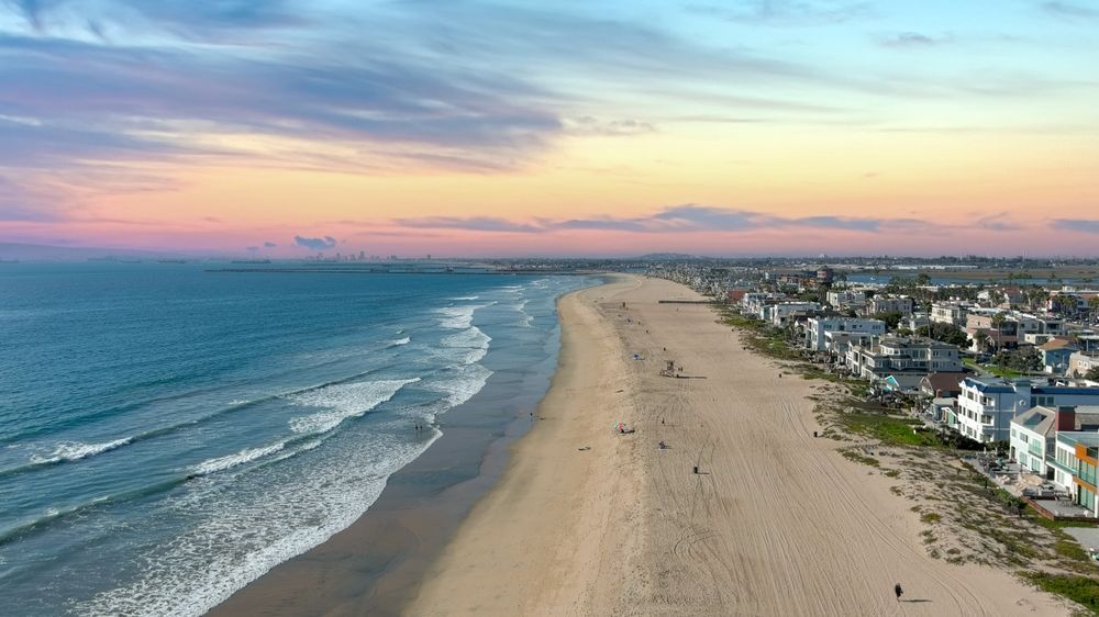 An aerial view of a beach at sunset.
