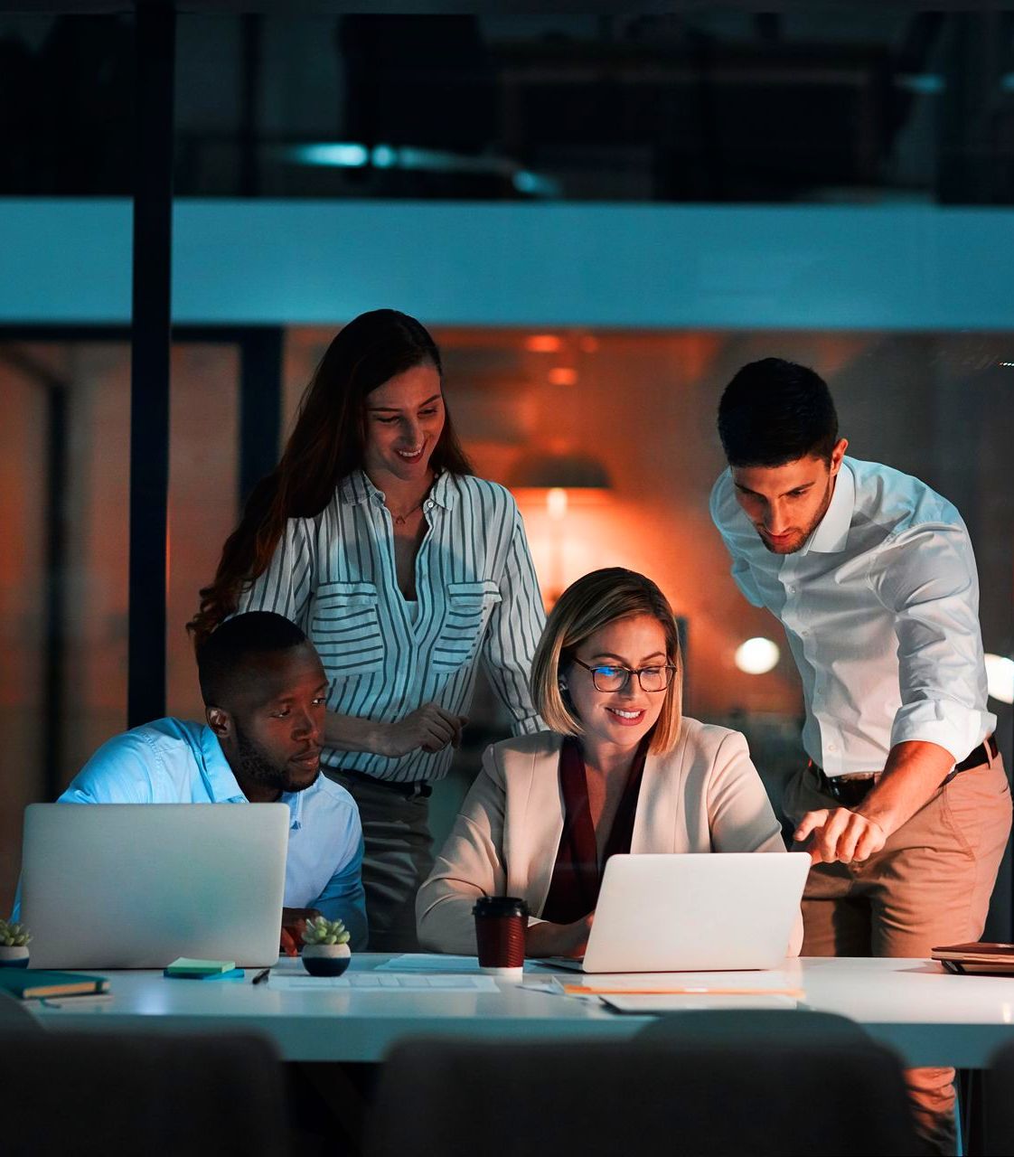 An employer and staff members looking over a PEO plan together