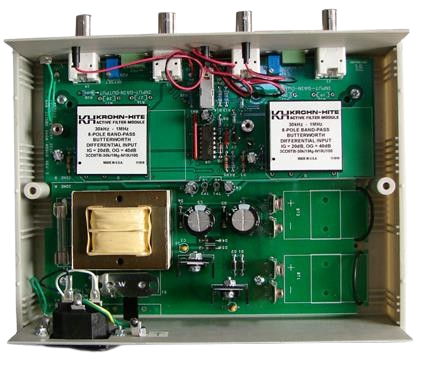 The inside of a box with a motherboard and a transformer