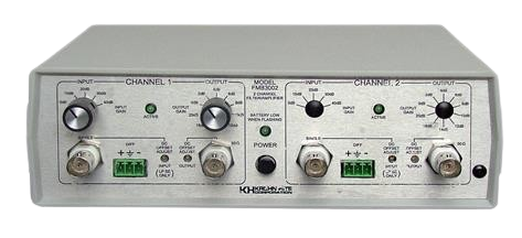 A gray box with a lot of buttons and knobs on it