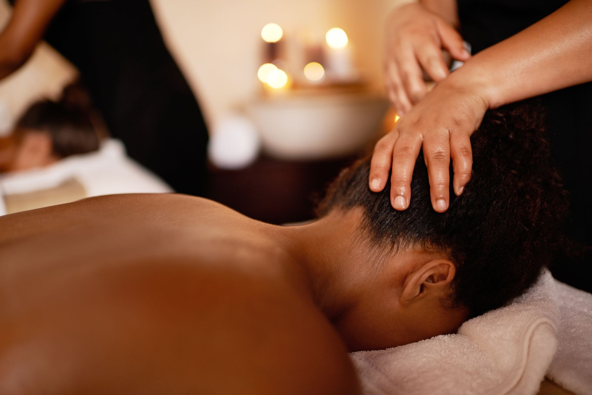 A woman is getting a massage at a spa.