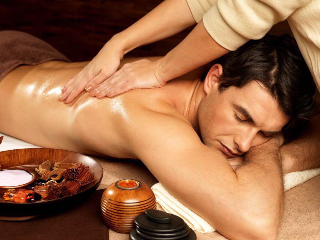 A man is getting a massage at a spa