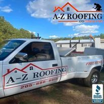 A white a-z roofing truck is parked on the side of the road.