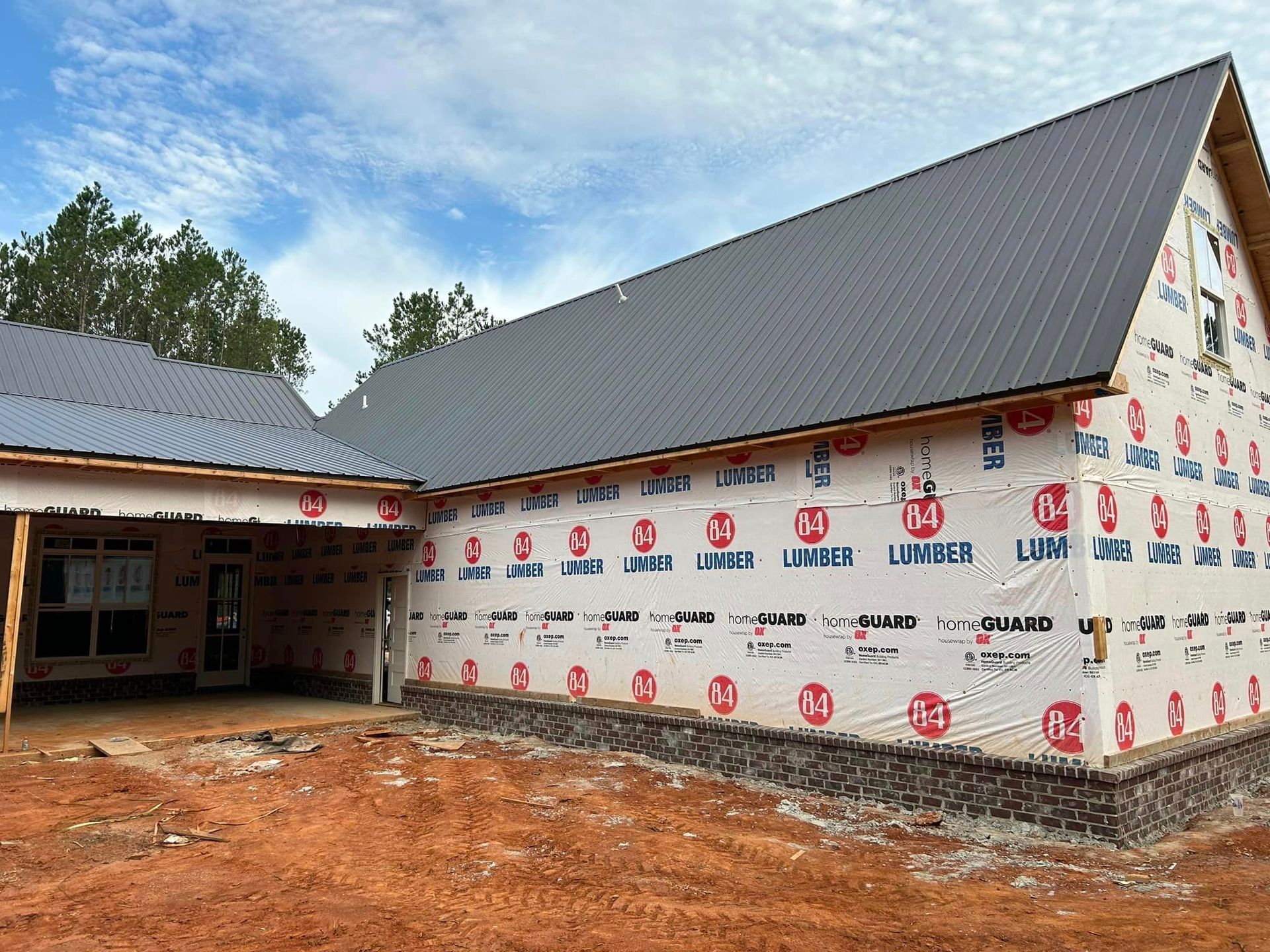 A house is being built with a lot of insulation on the side.