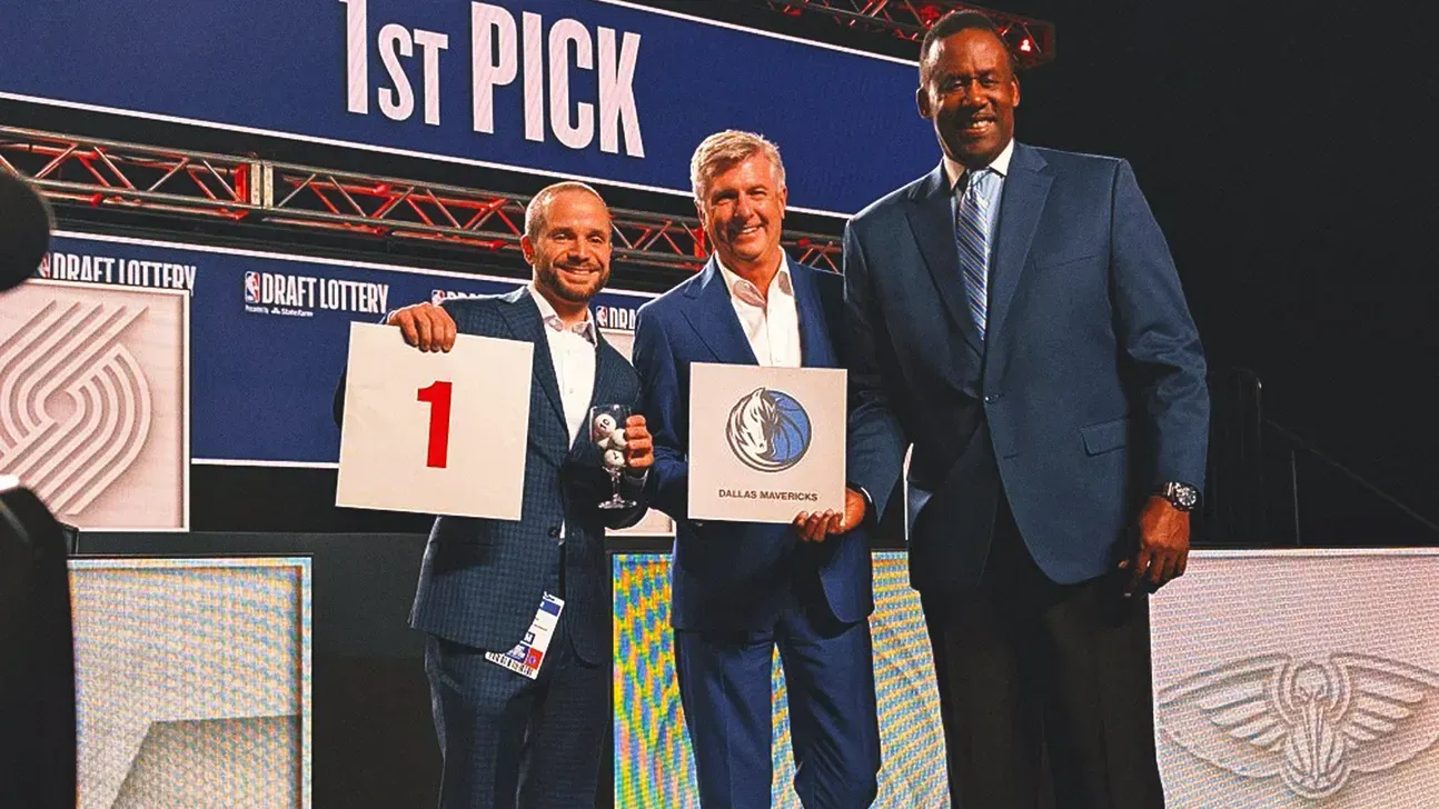 Three men in suits are standing next to each other holding a sign that says 1st pick.