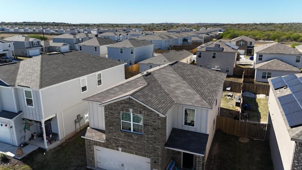 An aerial view of a roof with a lot of vents on it